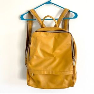 Vintage yellow leather backpack